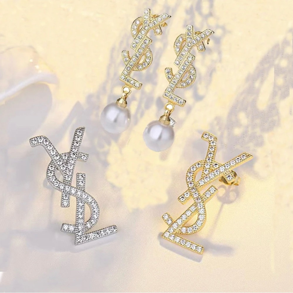 Stainless steel earrings YSL shaped. Silver needle diamonds